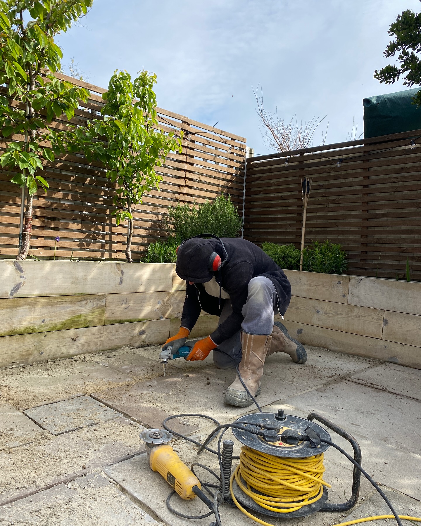 Natural stone patio being ground out and repointed by BPM Landscapes