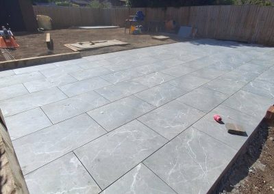 Chelmsford garden landscaping project with raised patio and concrete shed base